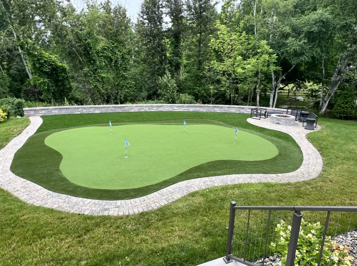 a house covered in a hedge next to a road