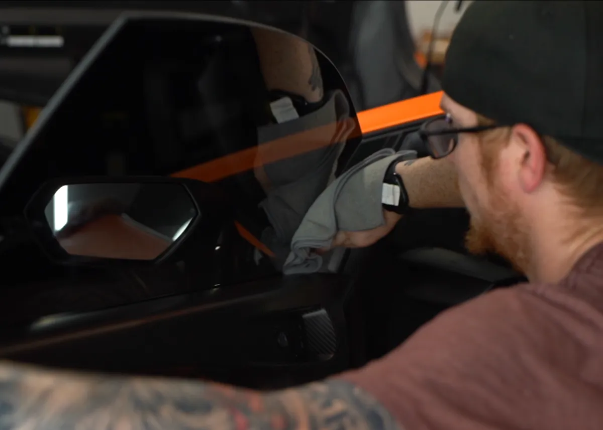 Tampa employeed installing car window tint