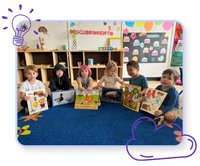 Children exploring colorful storybooks during a classroom activity at Blossoming Humans Spanish immersion preschool in Austin, Texas.