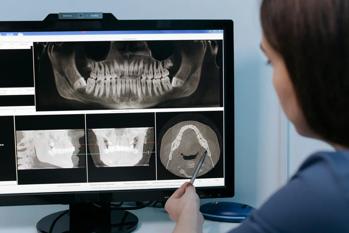 Female dentist looking at X-rays