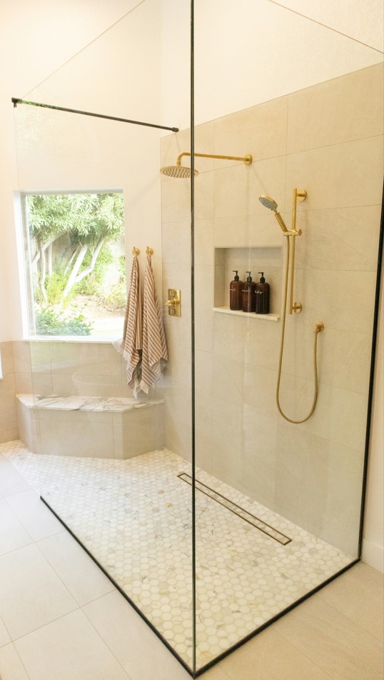 large beige frameless shower