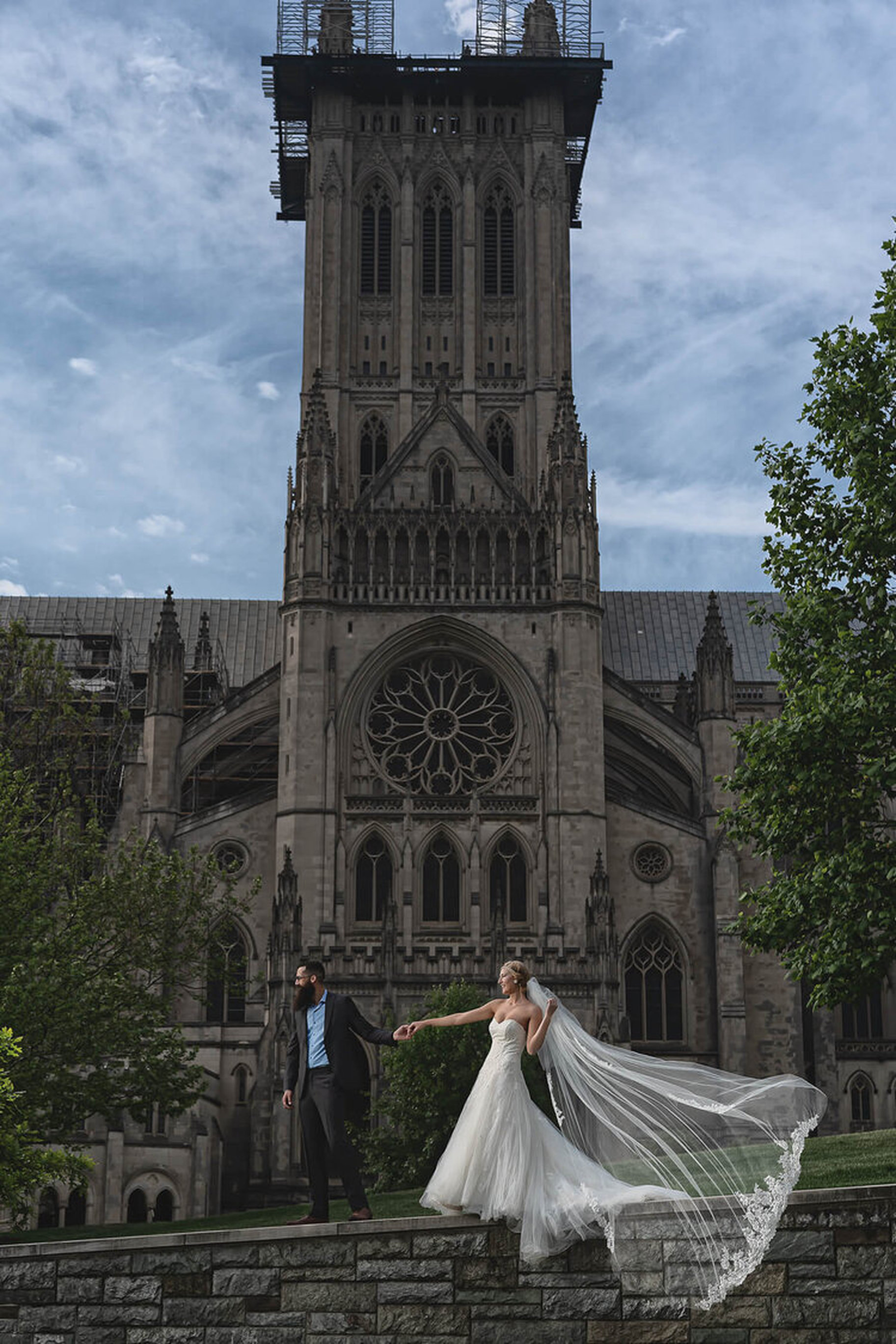 Bride with a flowing veil at the Washington National Cathedral, photographed by Hunter Scott Imagery