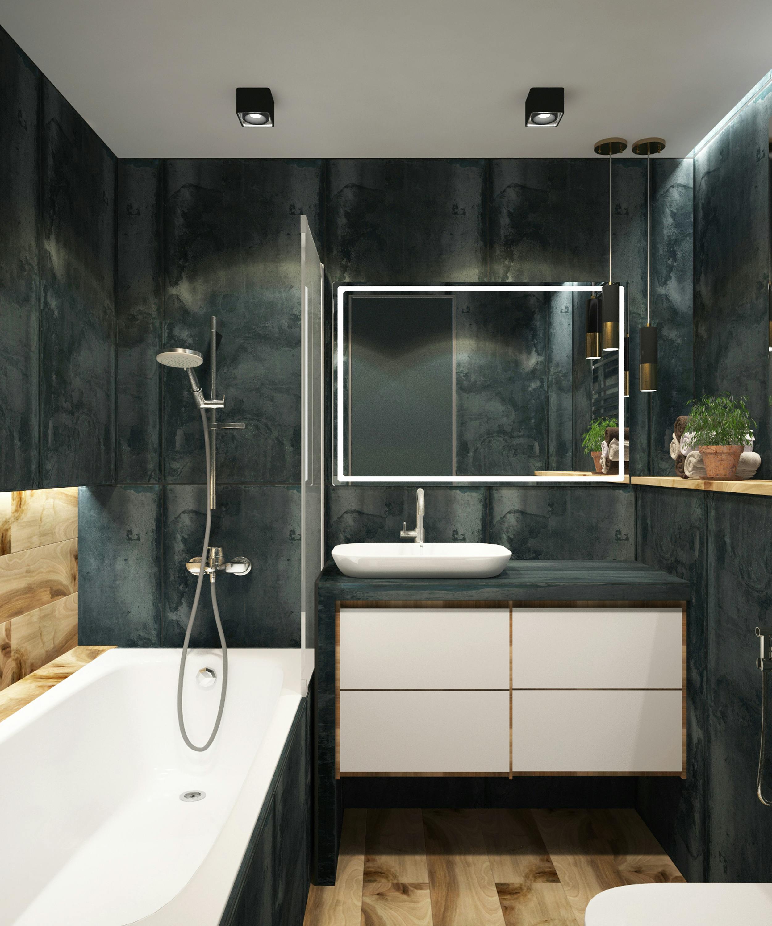 bathroom with black stone wal tiles, shower over bath and tap with vanity