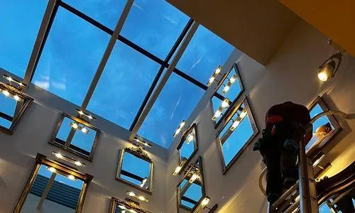 Clean View Window Washing technician cleaning interior skylight windows using 4-stage filtered water system in Scottsdale