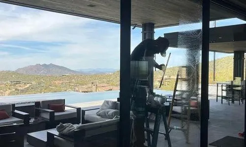 Desert home with floor-to-ceiling windows professionally cleaned showing streak-free results in Scottsdale Arizona