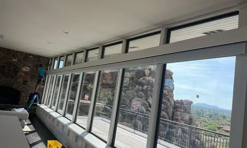 Luxury home interior featuring expansive clean windows with mountain views in Scottsdale Arizona