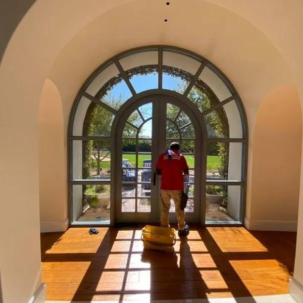 Crystal clear residential windows cleaned by WellDone Windows showing neighborhood view with spotless glass