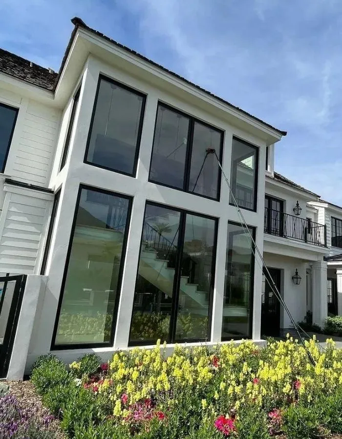 Spotless interior view of three windows with white trim showing blue sky through crystal clear glass