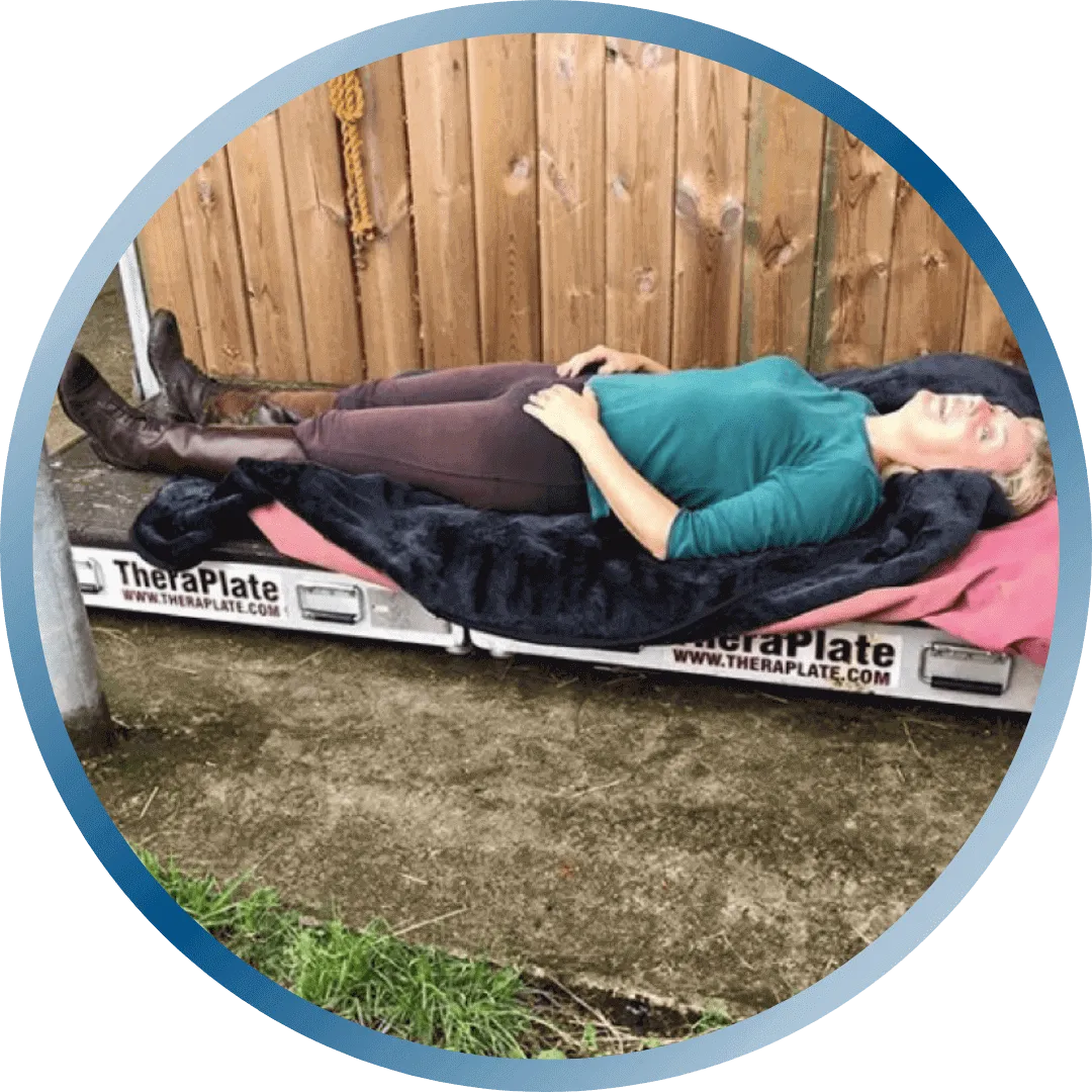 Woman lying her back on the TheraPlate