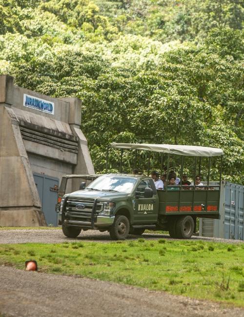 jurassic adventure tour jeep in front of jurassic world bunker