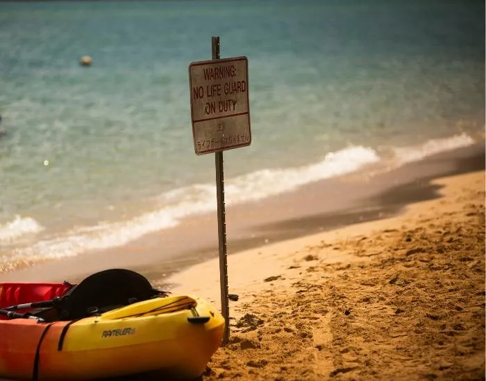 Kayak and Lifeuard Sign at Secret Island