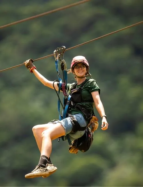 girl ziplining in hawaii at kualoa ranch