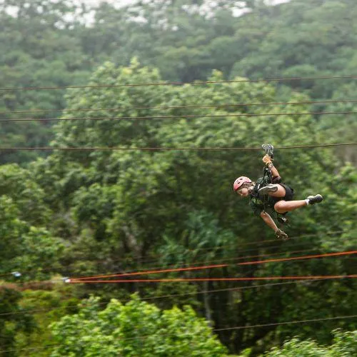 Girl zip lining at Kualo ranch