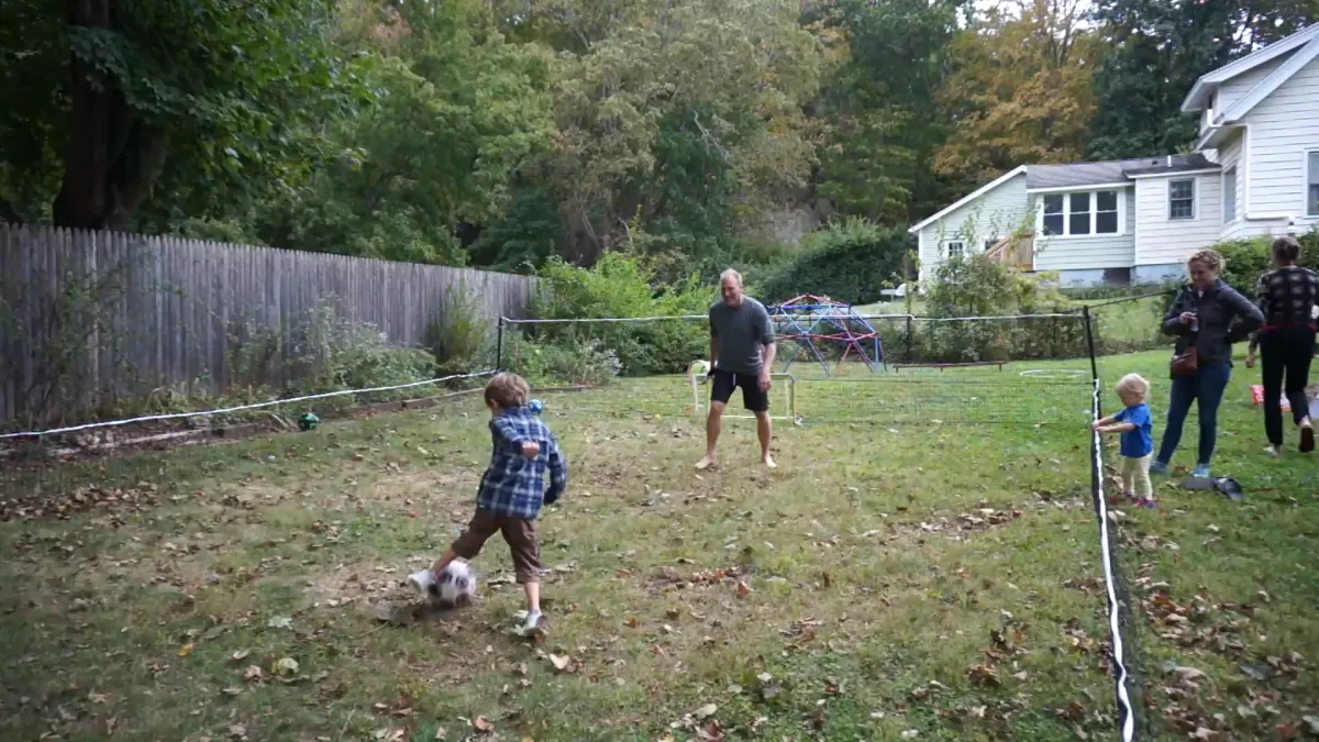 Adult rec players celebrating a goal on a SoccerYards Pro field