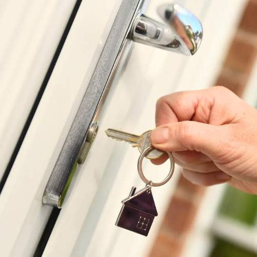 a locksmith finishes a customer's Lock Rekeying job in Douglasville, GS