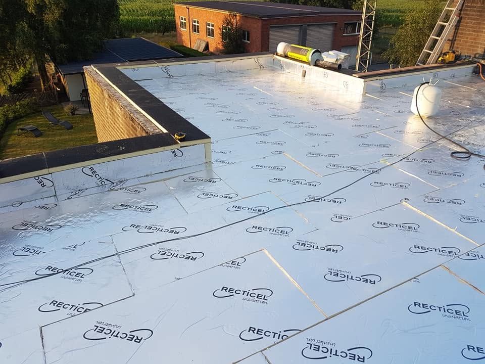 Flat roof renovation with clear square skylight