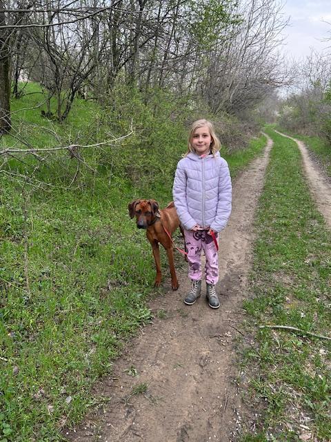Overlapping landscape photo of a cooperative water-harvesting project with a multi-generational team inspecting systems at sunset, warm tones, high-quality editorial photography showing long-term vision and collaboration.