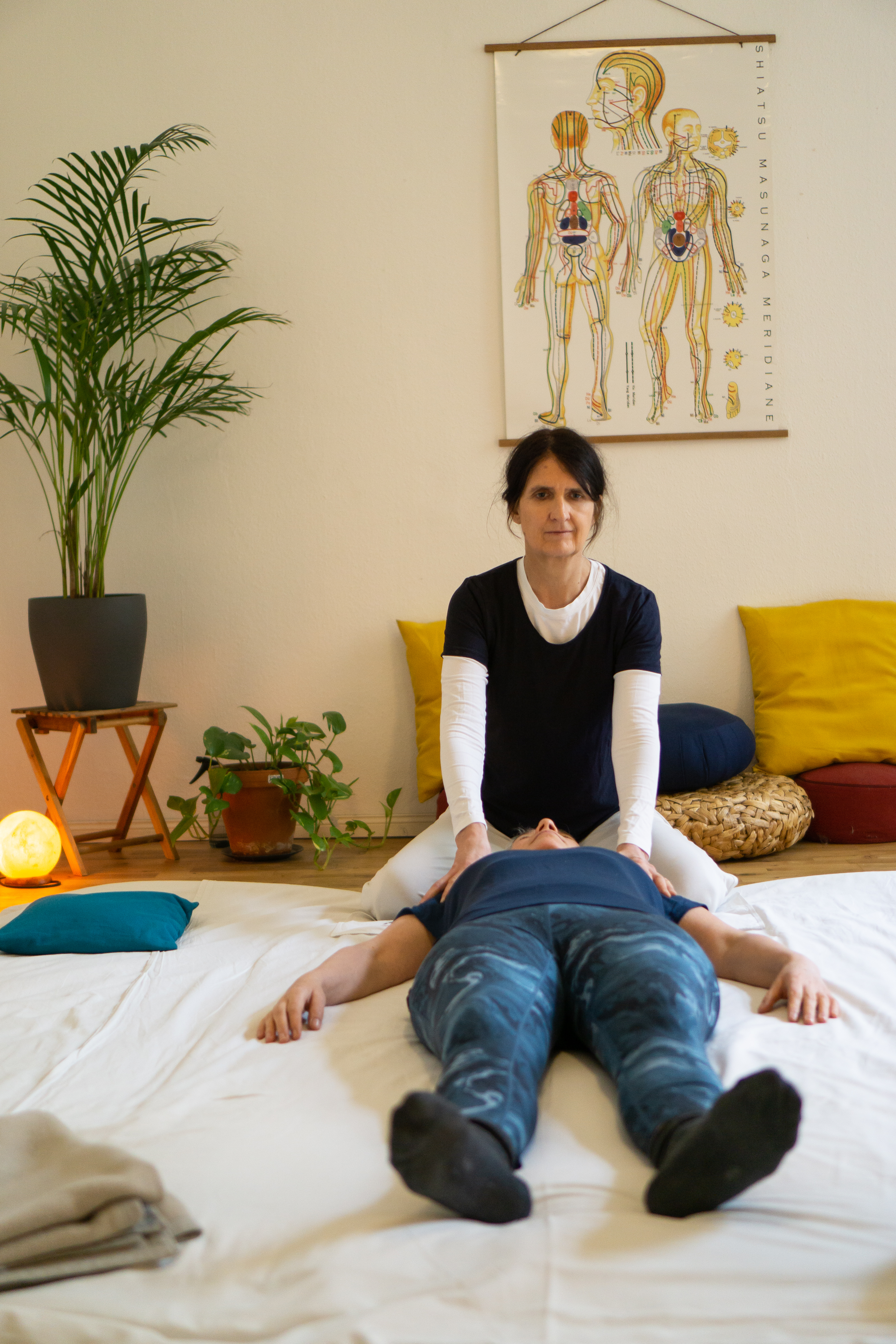 Overlapping landscape photo of a cooperative water-harvesting project with a multi-generational team inspecting systems at sunset, warm tones, high-quality editorial photography showing long-term vision and collaboration.