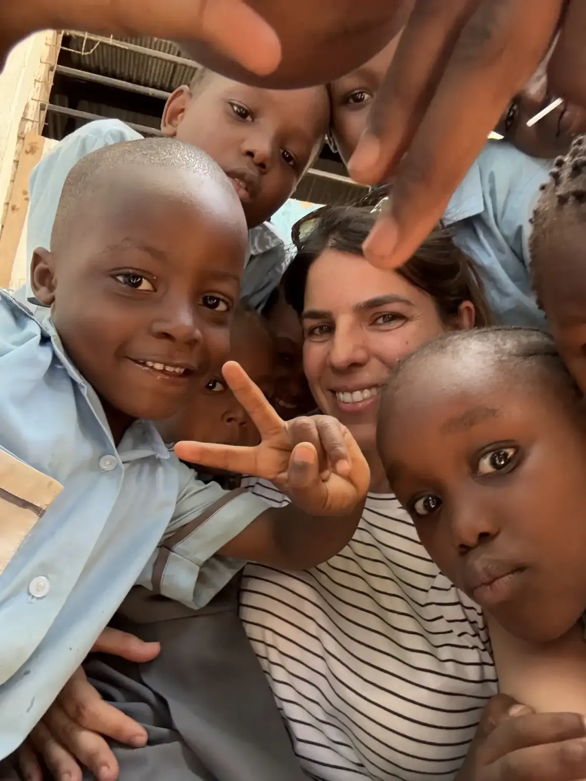 Overlapping landscape photo of a cooperative water-harvesting project with a multi-generational team inspecting systems at sunset, warm tones, high-quality editorial photography showing long-term vision and collaboration.