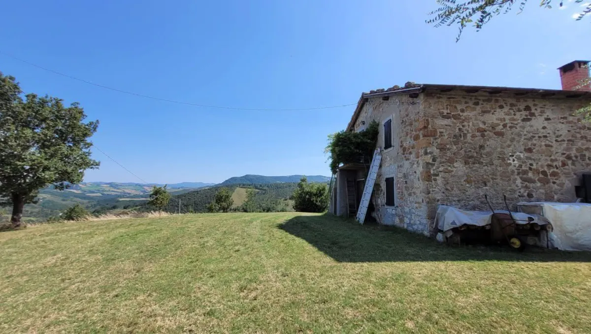 Overlapping landscape photo of a cooperative water-harvesting project with a multi-generational team inspecting systems at sunset, warm tones, high-quality editorial photography showing long-term vision and collaboration.