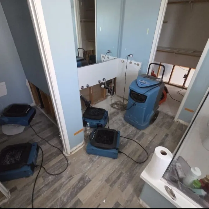 Water damage restoration emergency air mover drying in a Murrieta CA home