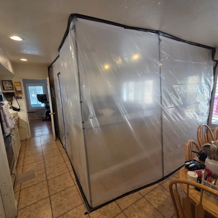 Water damage restoration containment setup in a Murrieta CA home