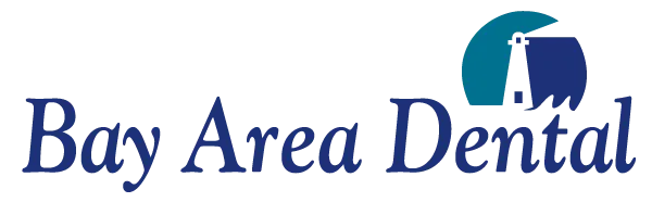 Logo for Bay Area Dental with a small lighthouse and blue and green text