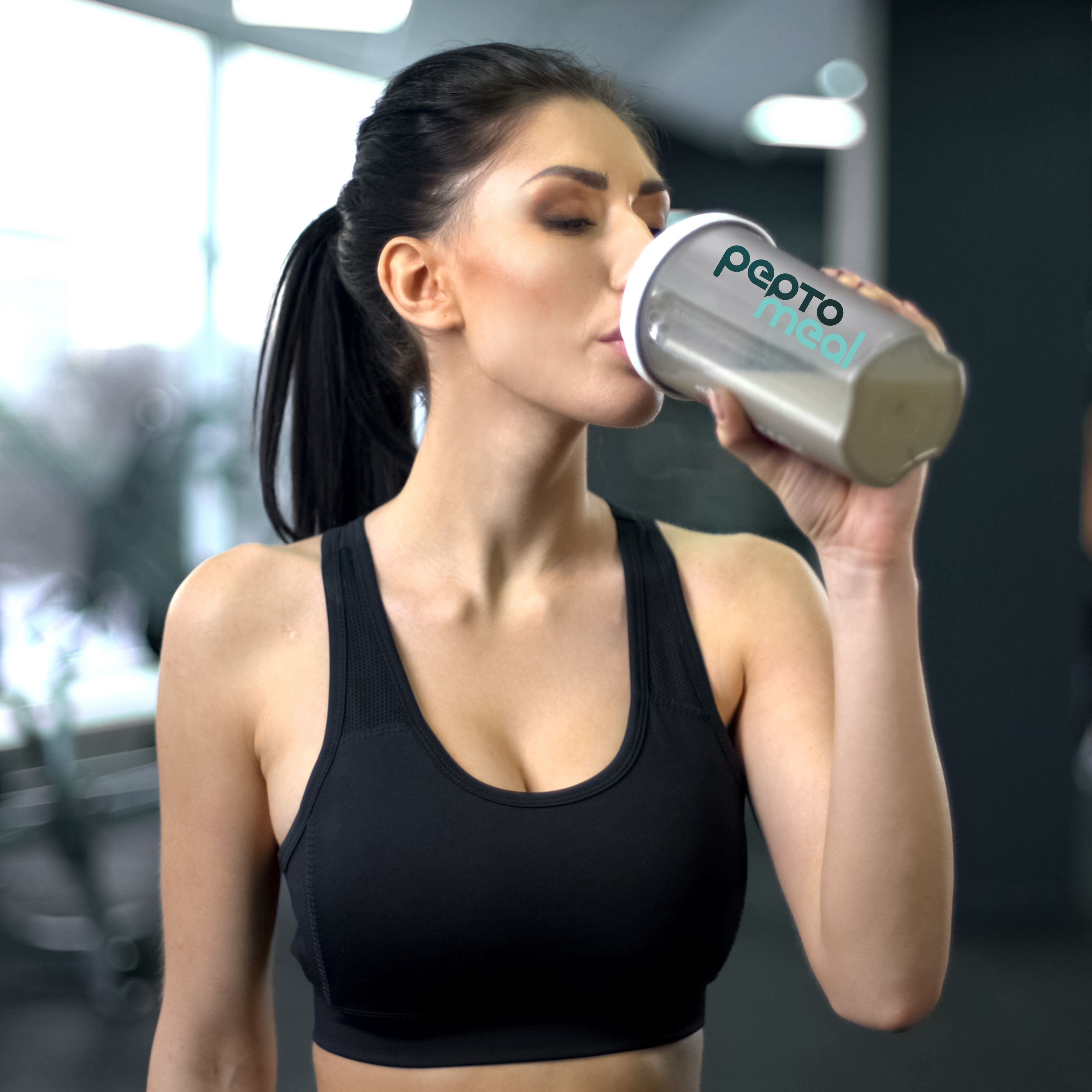 Athlete blending VitaShake after a workout, sporty lifestyle image (1:1).