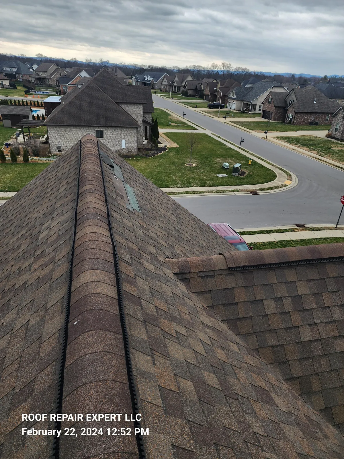 Aerial view of a damaged roof in Murfreesboro before the repair, showing the extent of storm damage