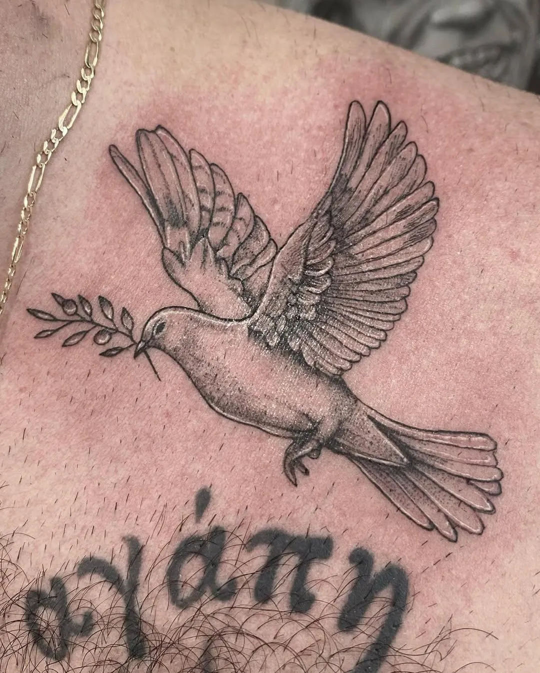 person with tattoo on right arm