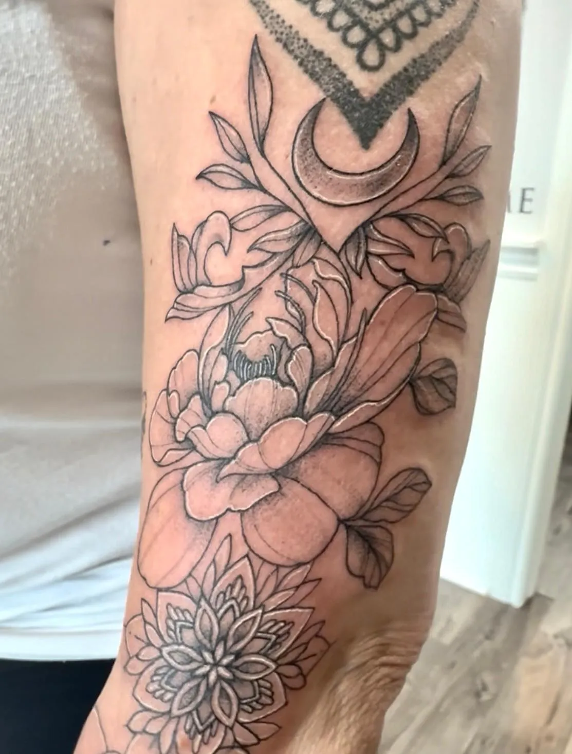 person in blue denim shorts and white nike sneakers standing on gray concrete floor