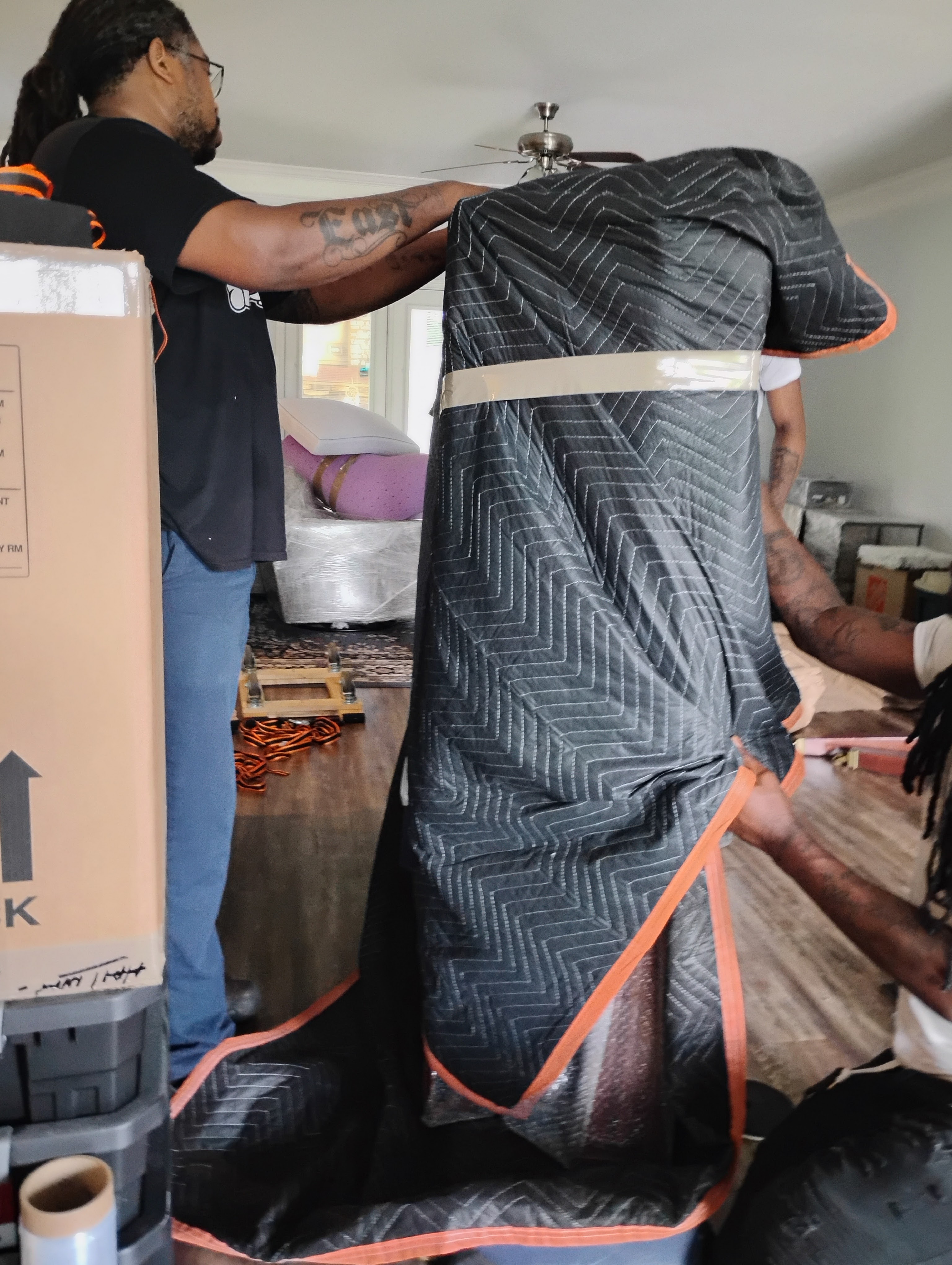 a man is unloading boxes from a van