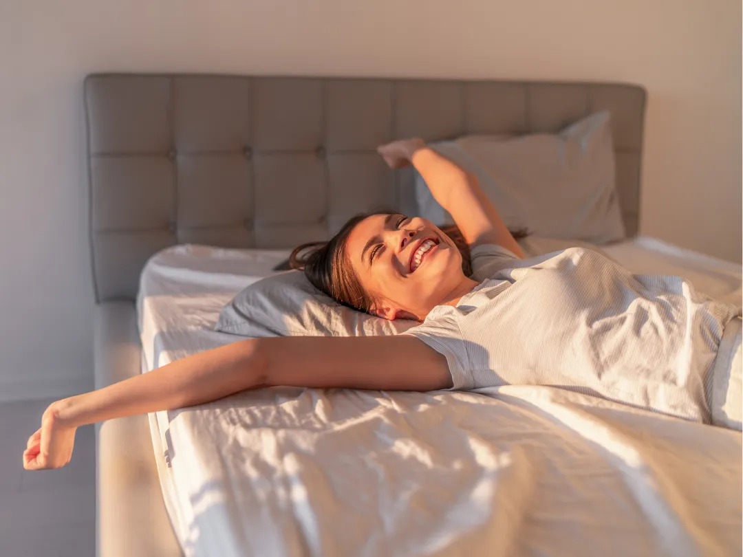 SomniLux delivery team unboxing a mattress at a customer's doorway; friendly staff in uniform, clean packaging; photorealistic image demonstrating the white-glove experience.