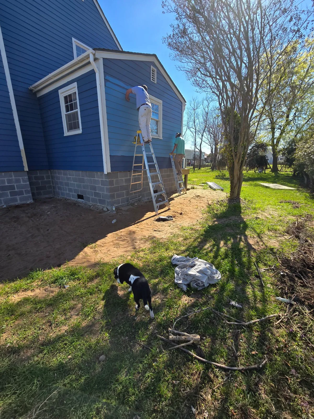 Side of a coastal home during an exterior repaint in Morehead City NC
