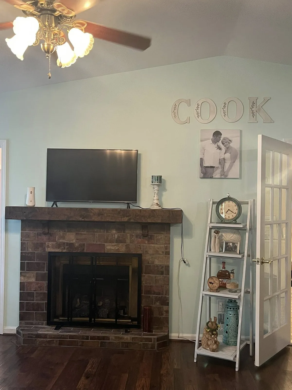 Living room with brick fireplace and fresh wall paint