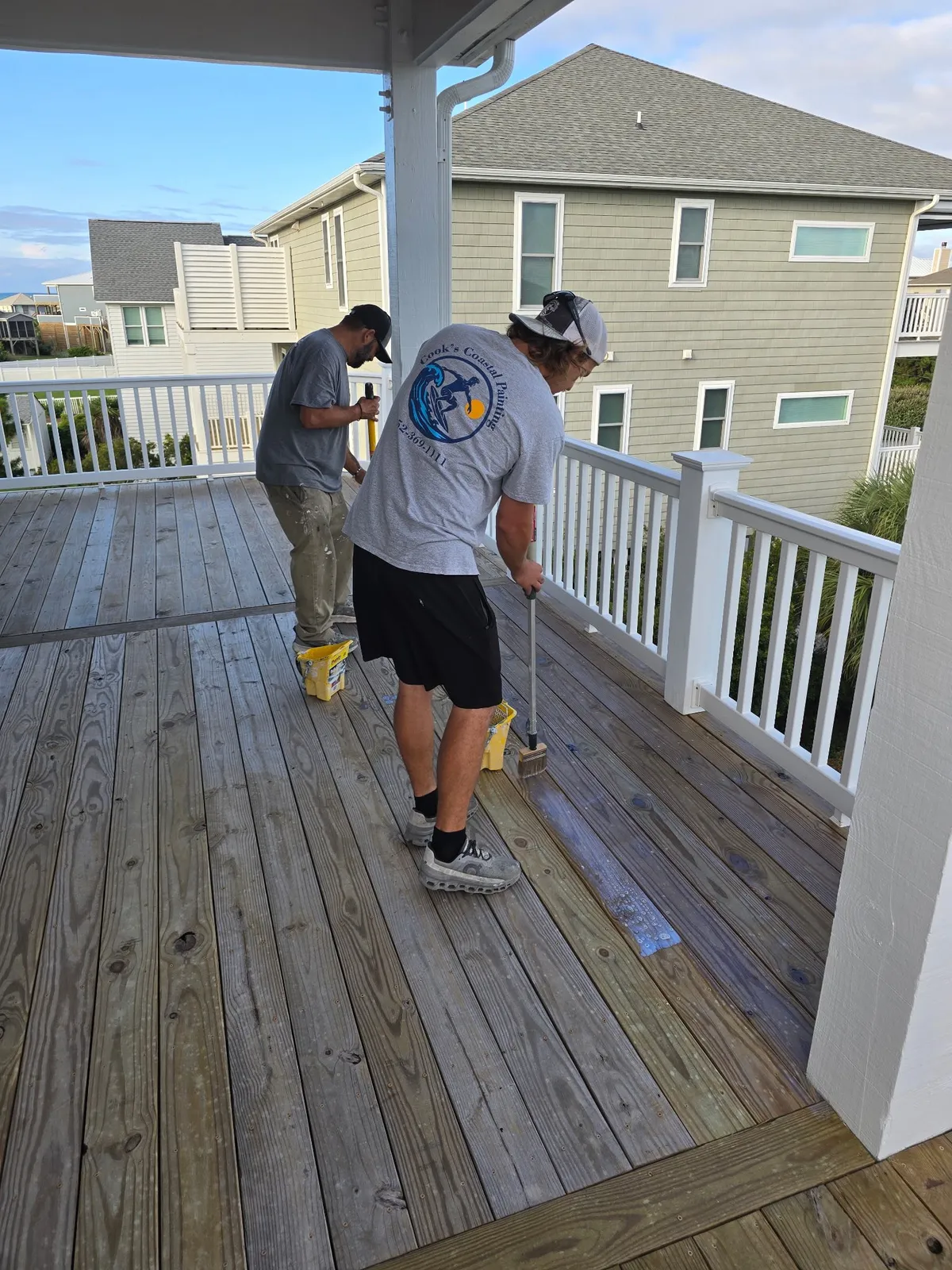 Crew member finishing a porch deck in Beaufort NC