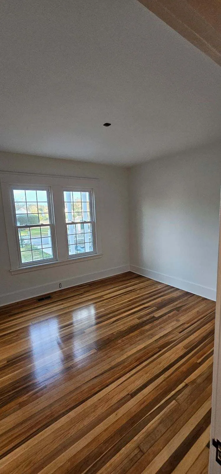 Bright bedroom with fresh paint and clean trim