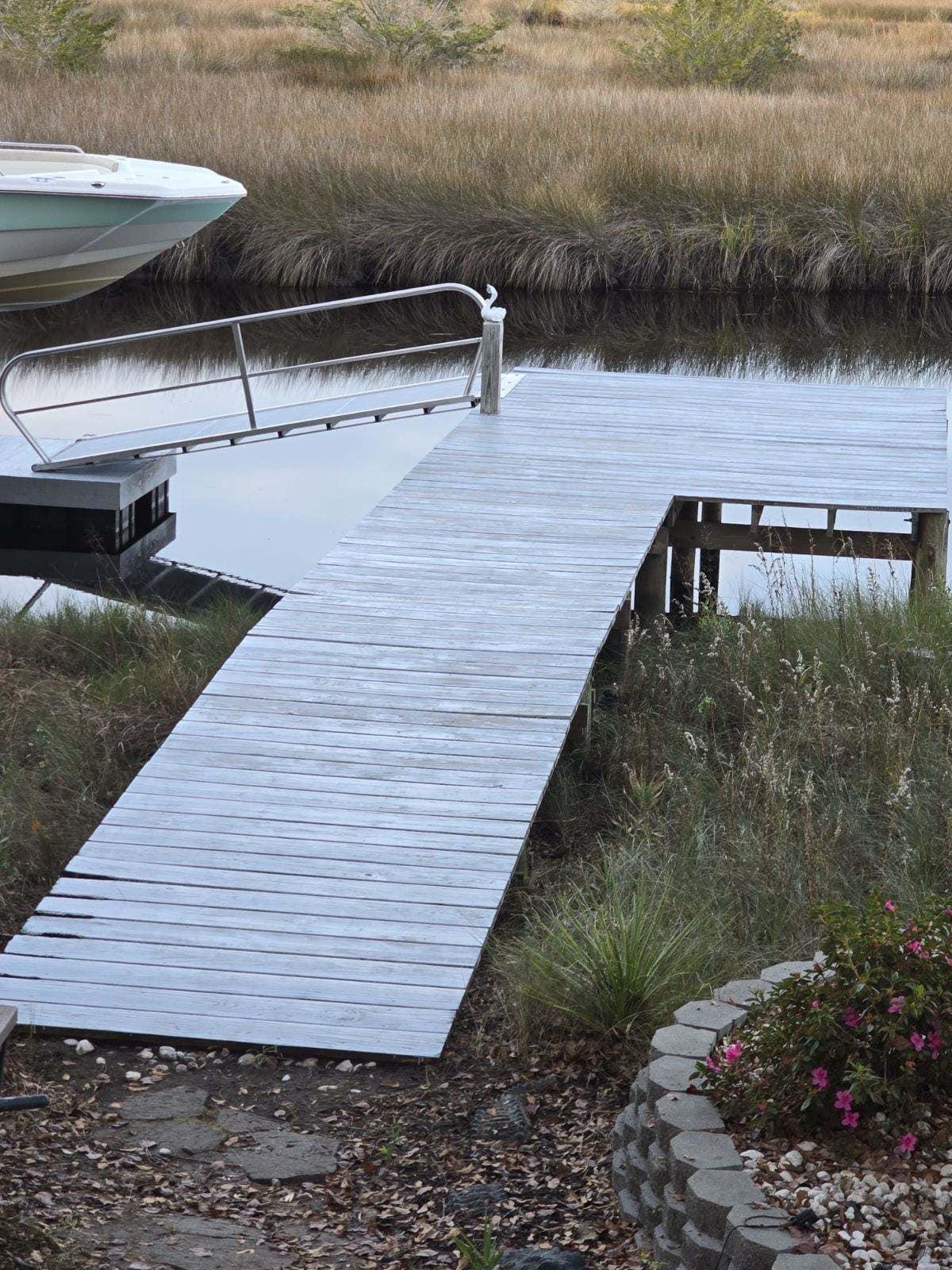 Long dock over the marsh after power washing