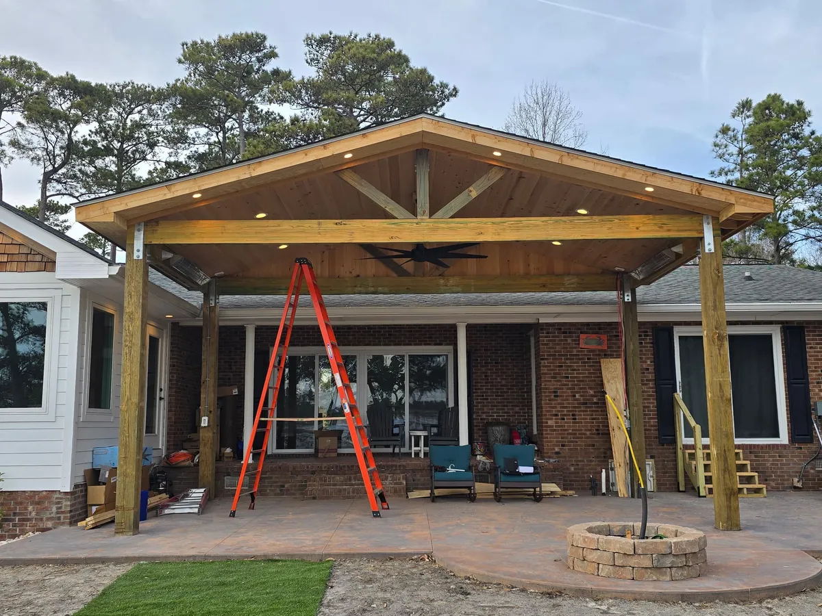 Covered wood porch structure being finished
