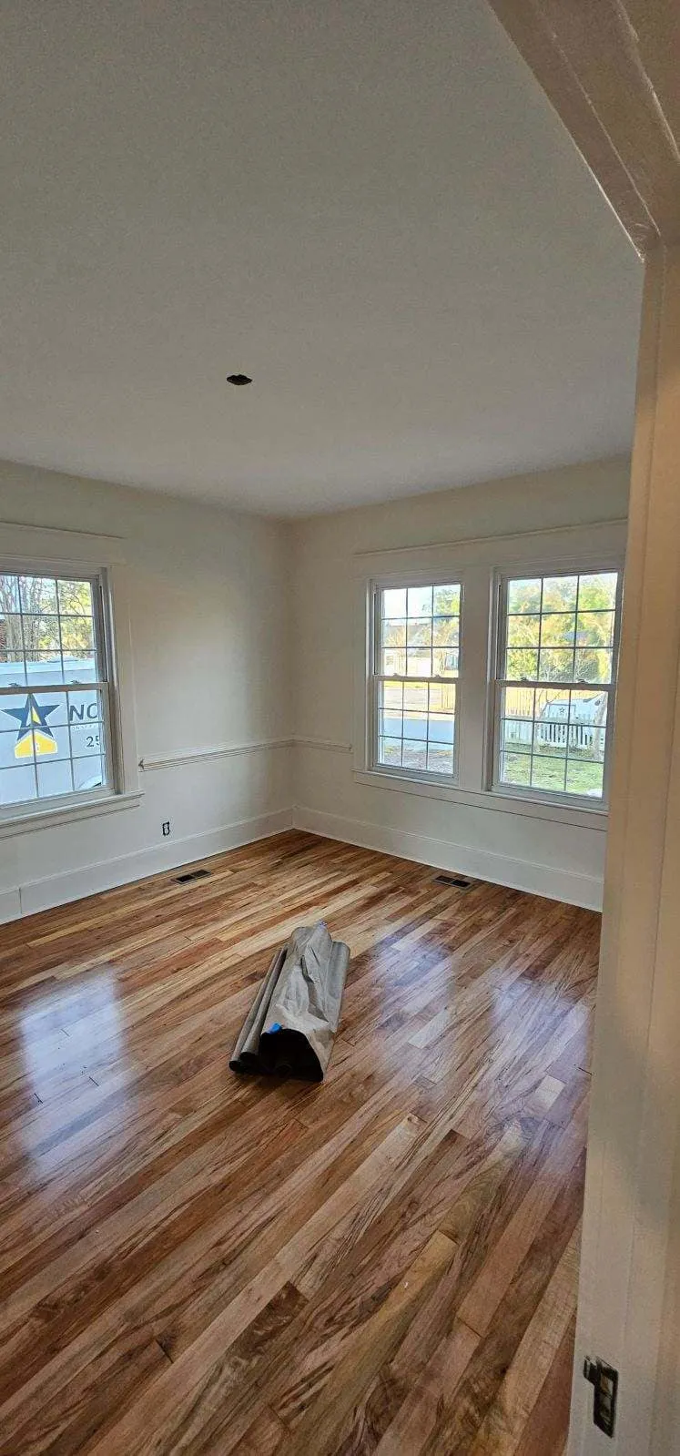 Room with fresh paint and wood floors