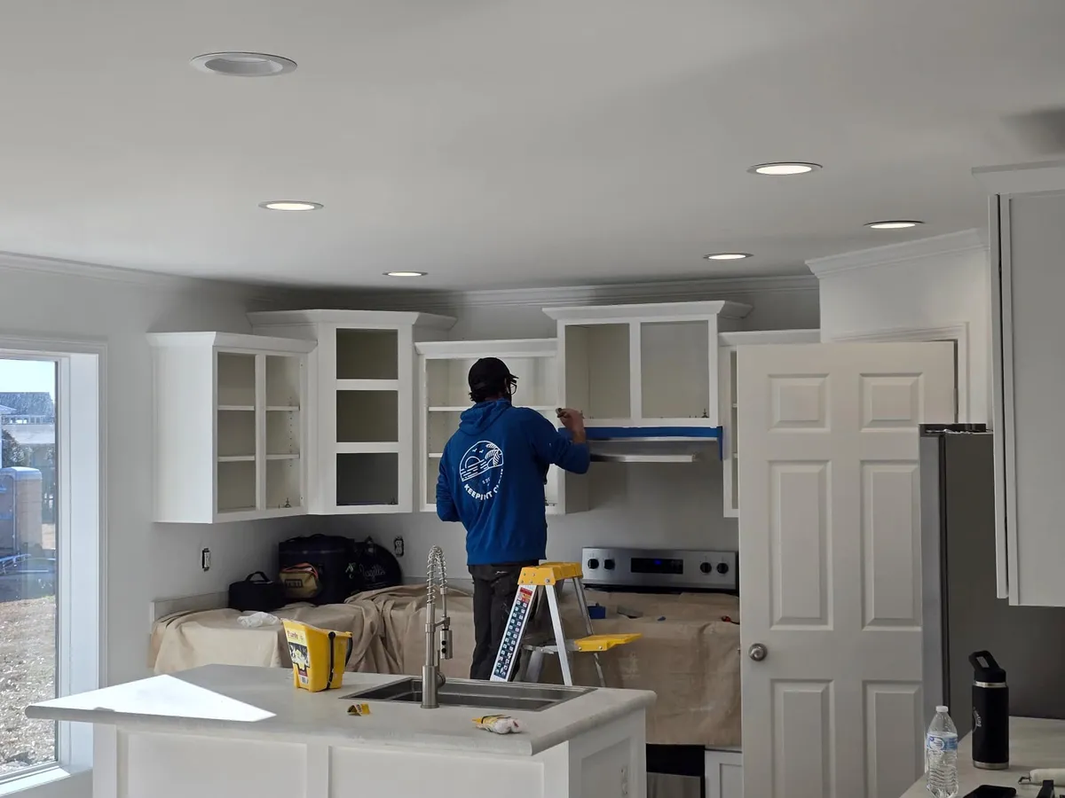 Cook's Coastal Painting crew painting a kitchen