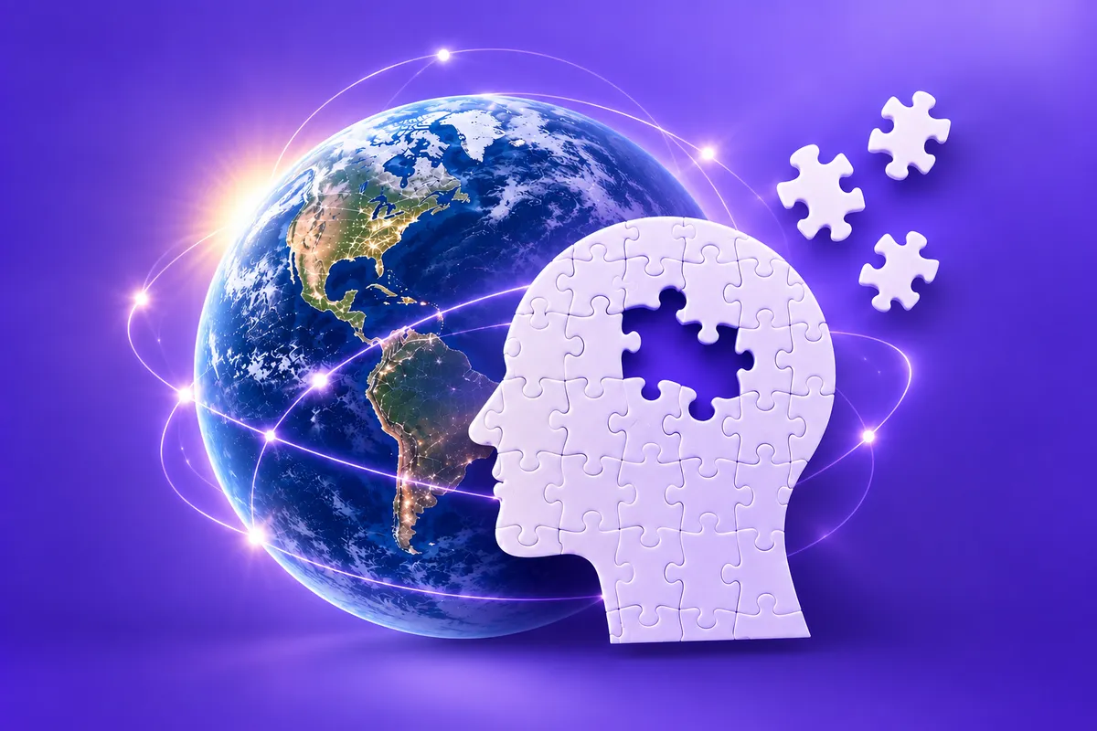 Silueta de una cabeza formada por piezas de rompecabezas frente al planeta Tierra, símbolo de la salud cerebral y el Alzheimer.