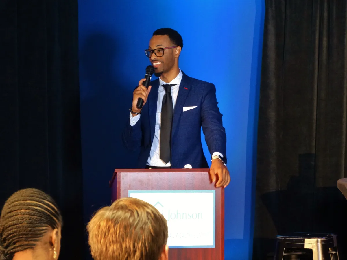Kito J. Johnson speaking at a podium