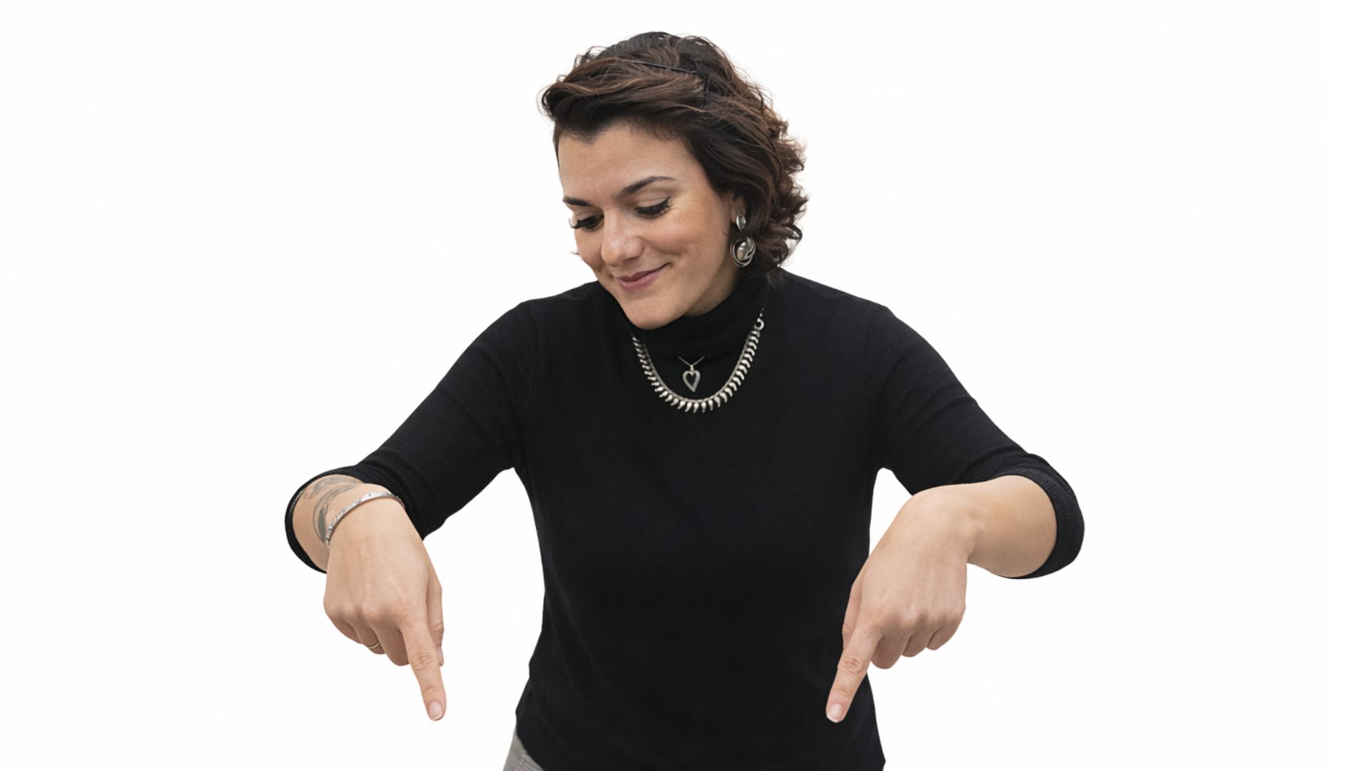 Image OfA woman pointing down