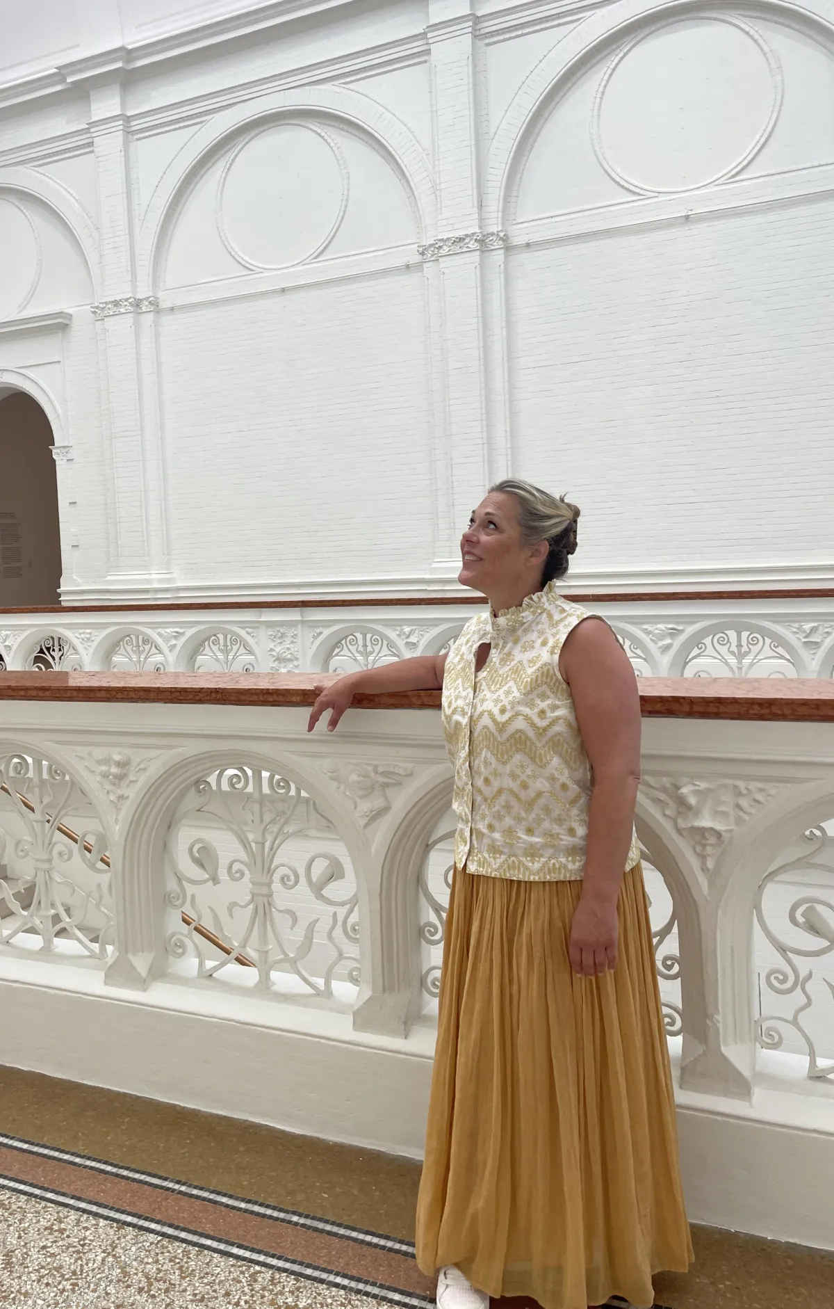 Pasha at an art museum in Pars looking upward in fascination.