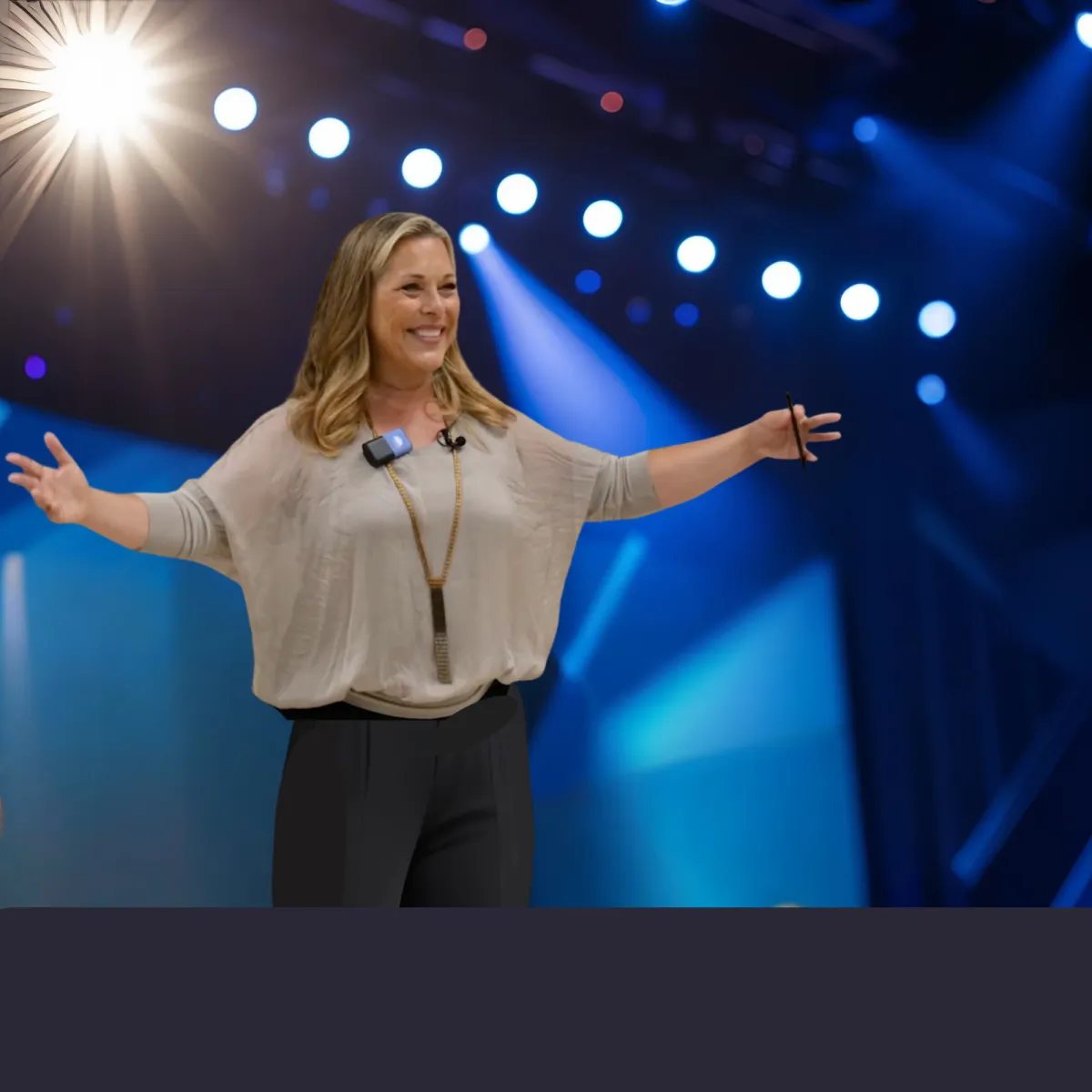 Pasha speaking on stage about how to support a neurodiverse workforce.