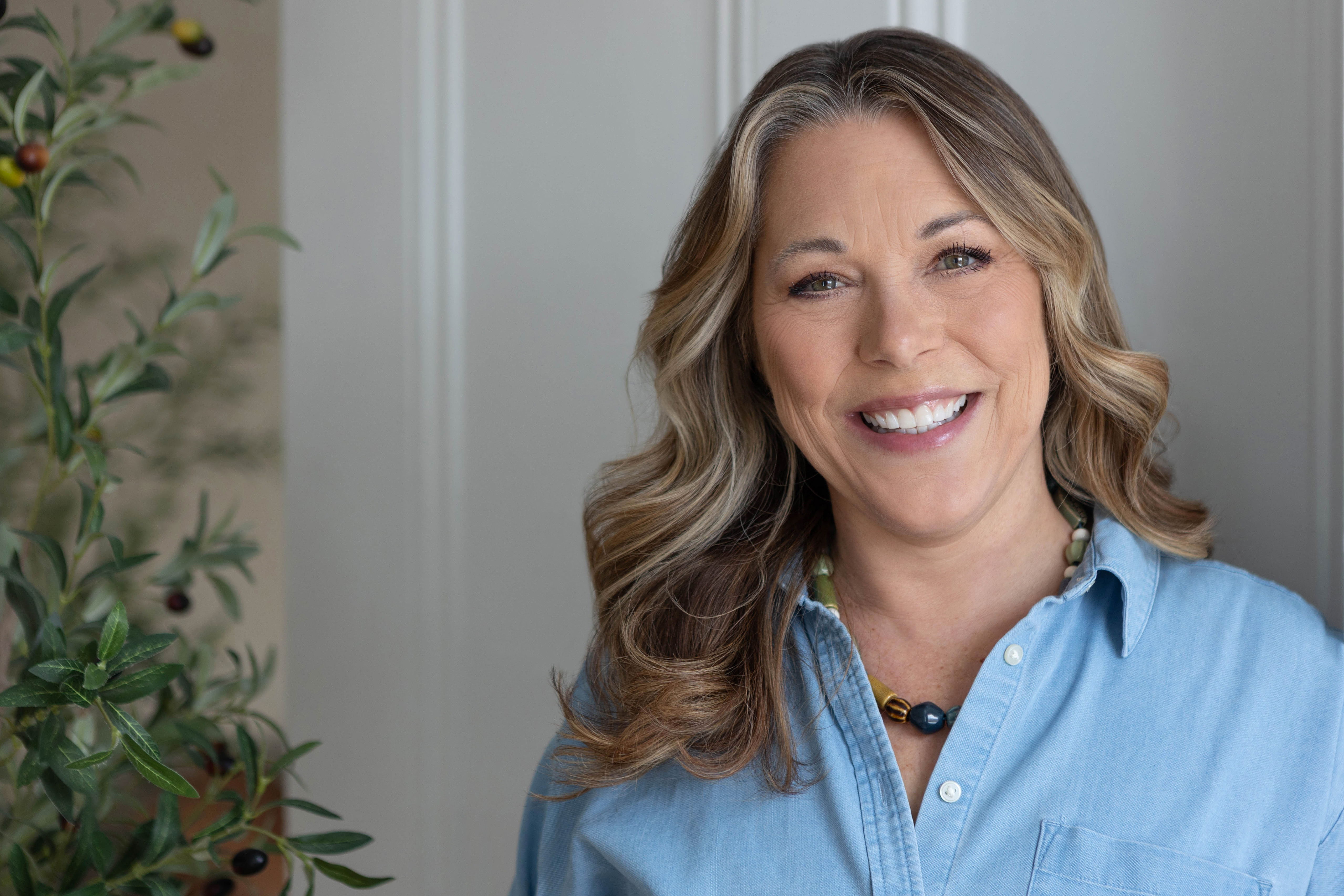 Pasha speaking on stage about how to support a neurodiverse workforce.