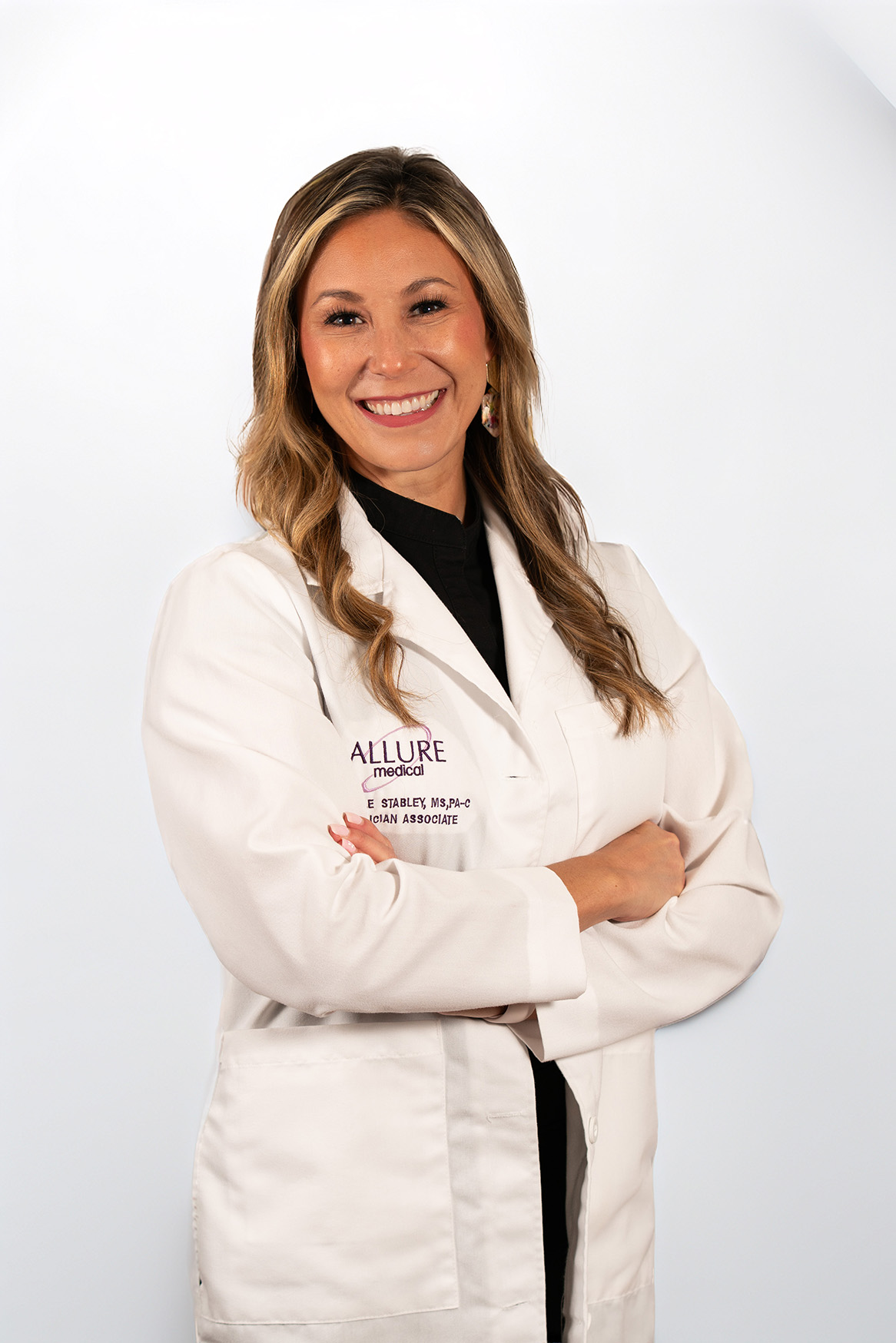 Experienced medical injector preparing a treatment in a pristine aesthetic clinic