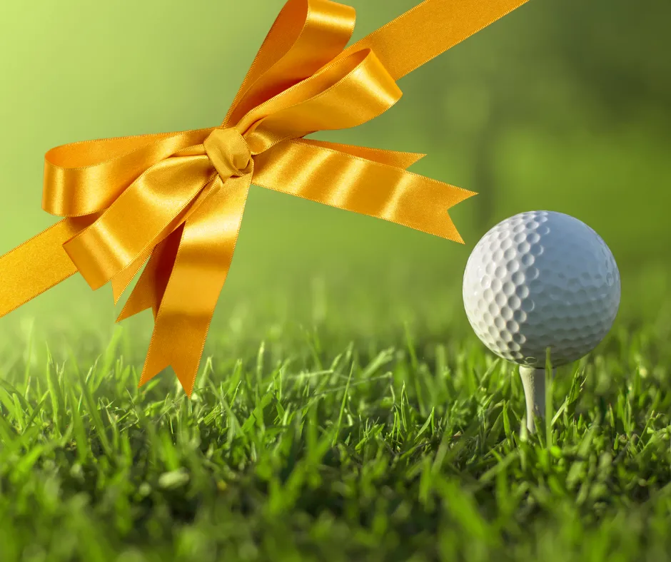 Gift bow around a golf ball on a tee