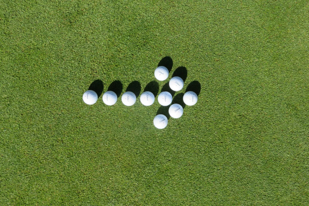 Golf Balls forming an arrow to the right